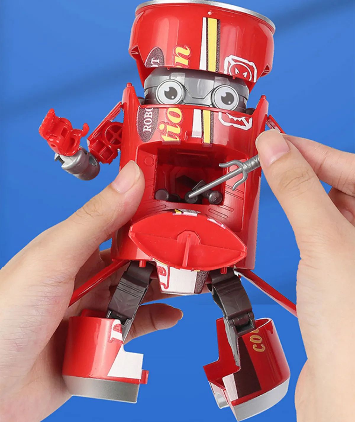 The chest area of Red Coca Cola Soda Can Drinks Transformer​ Toy is designed with a small hidden compartment for easy weapon storage.